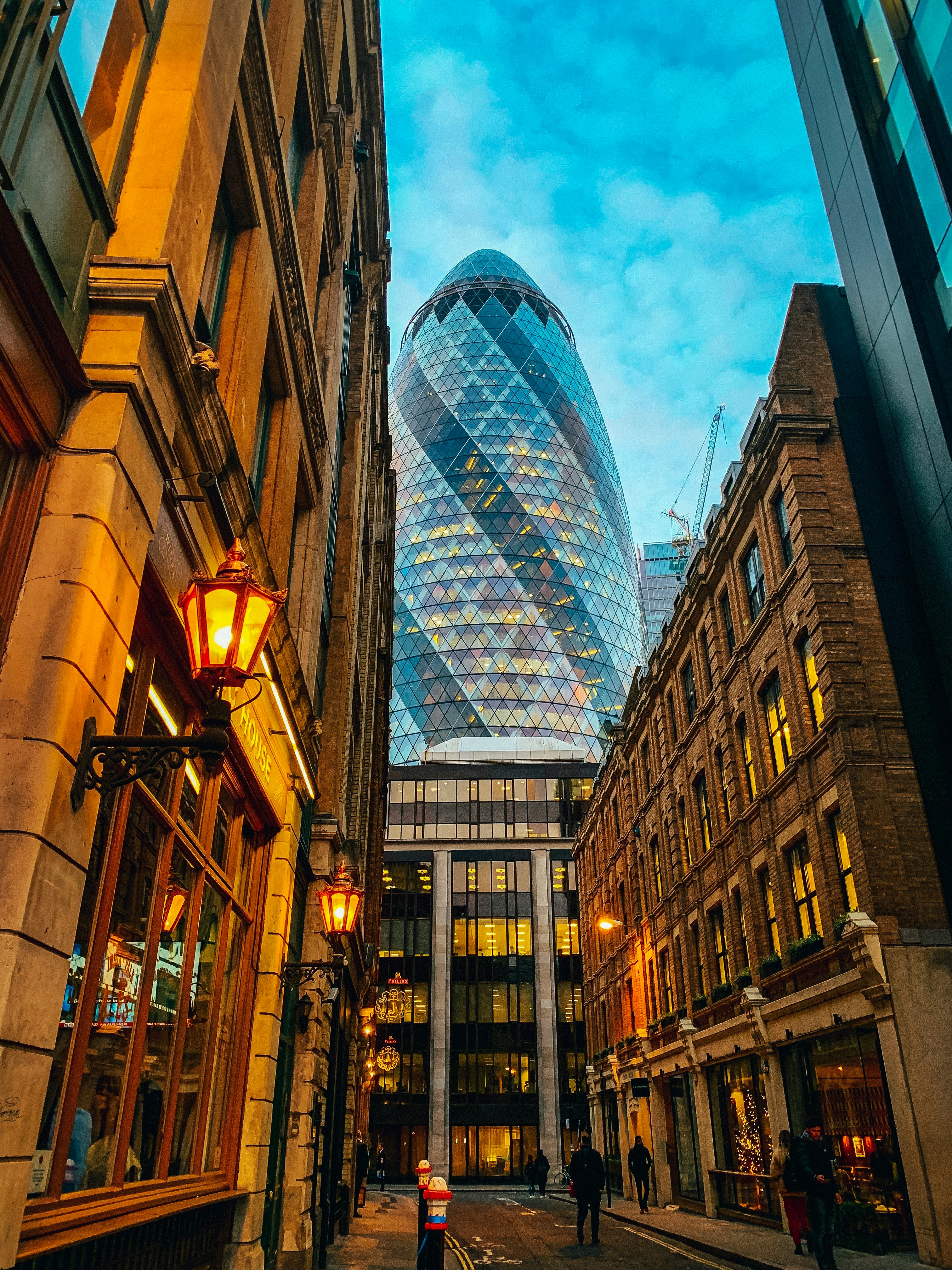 low-angle photography of a glass hotel building in the city during daytime